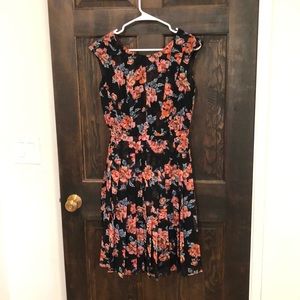 Cute, fun dress.  No imperfections. Too small for me now.